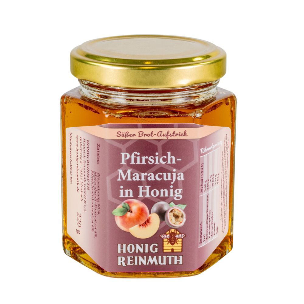 sechseckiges Glas mit goldenem Deckel mit Etikett gefüllt mit flüssigem Honig