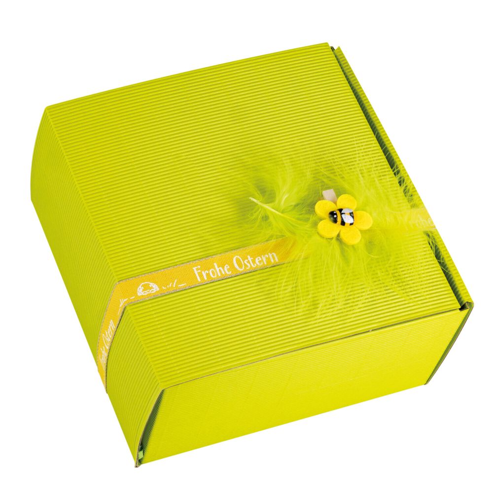 schachtel mit banderole mit blume und feder verziert