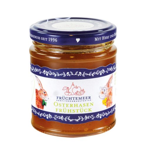 Glas mit blauem Deckel mit Etikett gefüllt mit Konfitüre