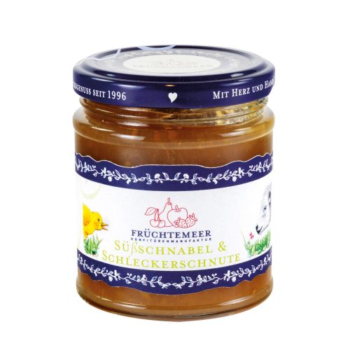 Glas mit blauem Deckel und Etikett, gefüllt mit Fruchtaufstrich