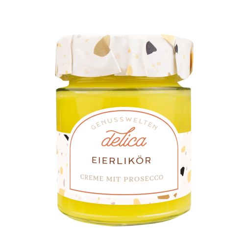 Glas mit Etikett. Deckel mit Überzug. Glas gefüllt mit gelber Creme