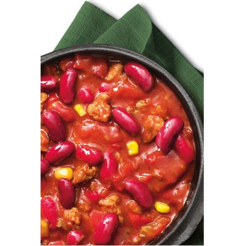 Chili sin carne in Pfanne auf grüner Serviette