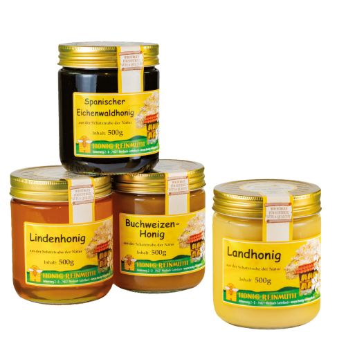 4 Gläser Honig mit goldenem Deckel und Etikett mit Banderole.