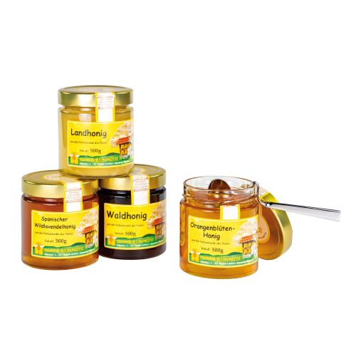 4 Gläser Honig mit goldenem Deckel und Etikett , ein Glas mit eingehängtem Honiglöffel aus Edelstahl